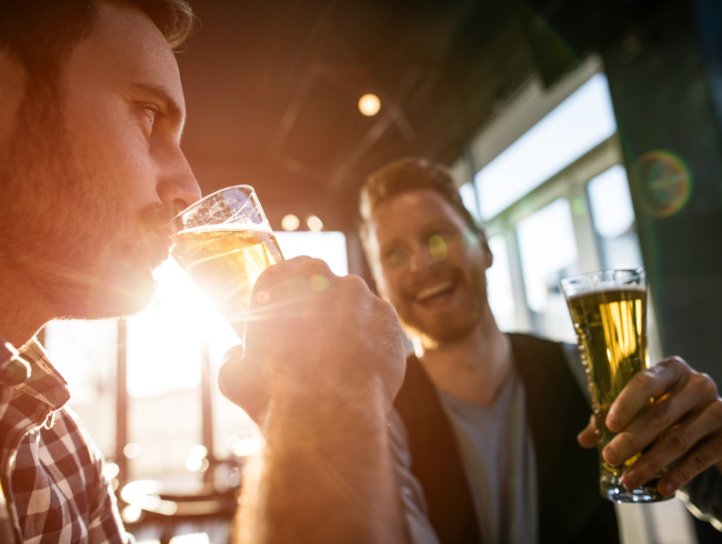 men drinking beer at a restaurant 
